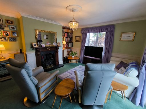 The living room, which leads on to the conservatory