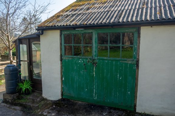 Another potential garage, currently serving as garden storage