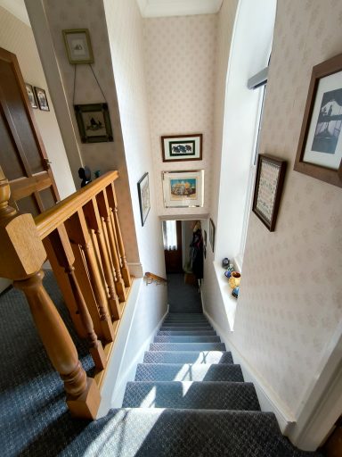 The stairway is well lit by a large window